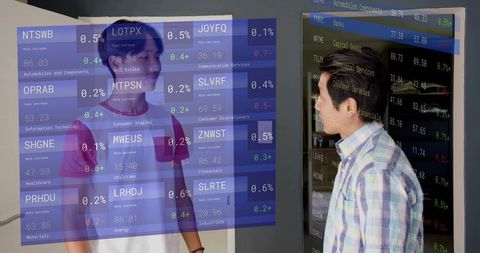 Mentor guiding teen through interactive financial dashboard with augmented data overlay