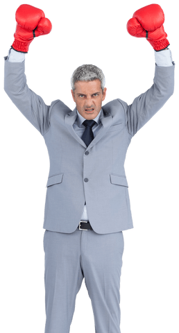 Determined businessman unleashing fury with red boxing gloves transparent