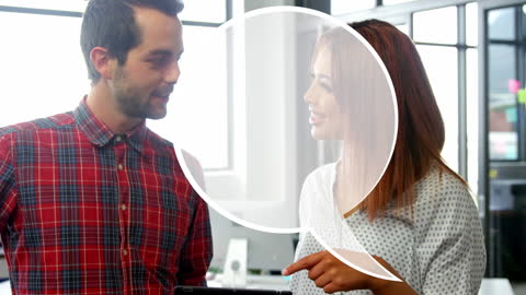 Colleagues Discussing Digital Marketing Strategy in Modern Office