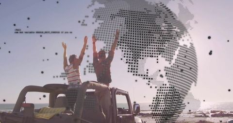 Two Men Raising Arms Standing on Jeep Roof at Seaside with Halftone Globe Overlay