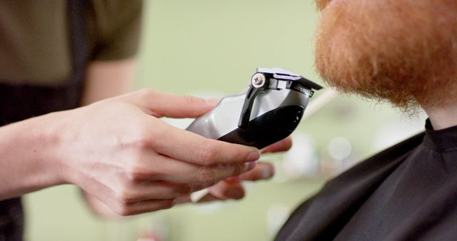 Barber Trimming Beard with Electric Trimmer in Barber Shop - Download Free Stock Images Pikwizard.com