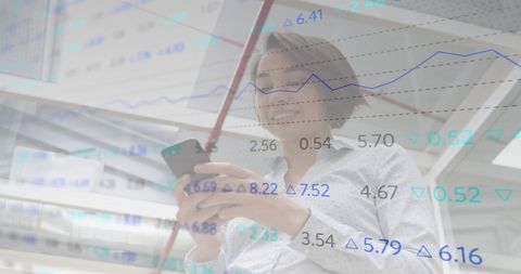 Woman Analyzing Financial Data with Smartphone in Office