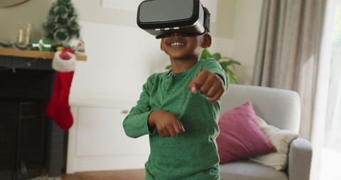 boy enjoying vr experience during christmas at home - Download Free Stock Images Pikwizard.com