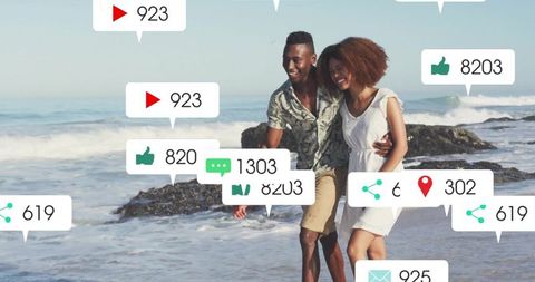 Couple Walking on Beach with Social Media Engagement Icons