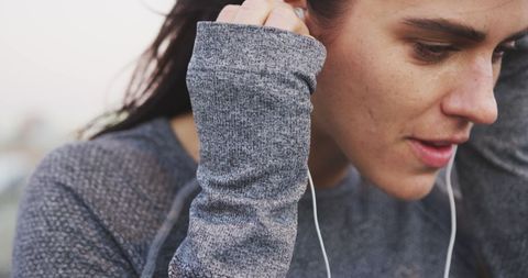 Woman Preparing for Morning Workout with Earphones