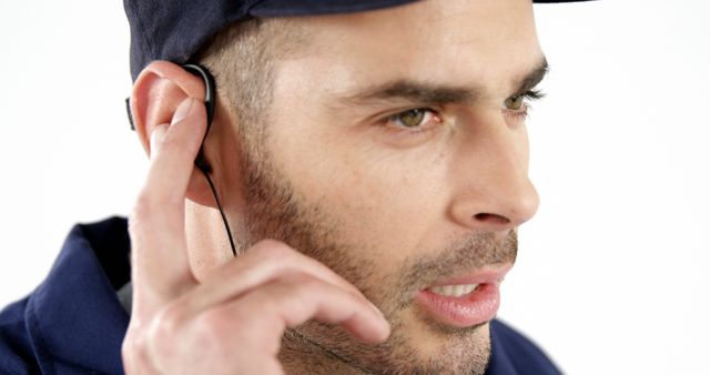 Close-up of Man Wearing Wireless Earbud and Communicating - Download Free Stock Images Pikwizard.com
