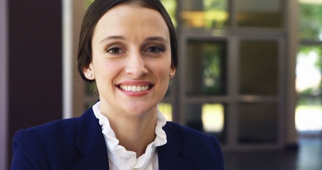 Professional Businesswoman Smiling in Office Lobby - Download Free Stock Images Pikwizard.com