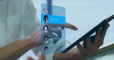 Business team interacting with holographic contacts on tablet for digital collaboration