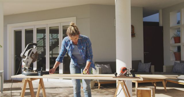 Woman Measuring Wood Plank for DIY Home Project Outdoors - Download Free Stock Images Pikwizard.com