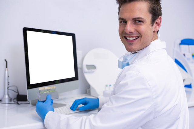 Happy Dentist Wearing Gloves Using Computer with Transparent Background - Download Free Stock Videos Pikwizard.com