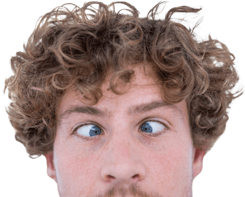 Casual man with curly hair grimacing and crossing eyes