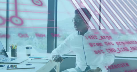 Tech Professional Analyzing Financial Data at Office Desk