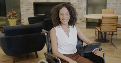 Inclusive Business Environment with Smiling Woman in Wheelchair - Download Free Stock Images Pikwizard.com