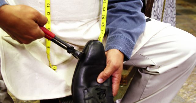 Cobbler Repairing Black Shoe with Hand Tools - Download Free Stock Photos Pikwizard.com