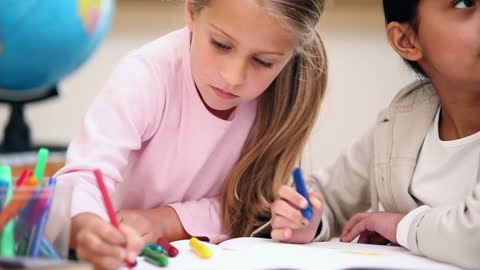 Children Collaborating on Art Project in Classroom