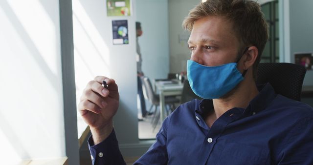 Office Worker Wearing Face Mask and Reflective Expression - Download Free Stock Images Pikwizard.com