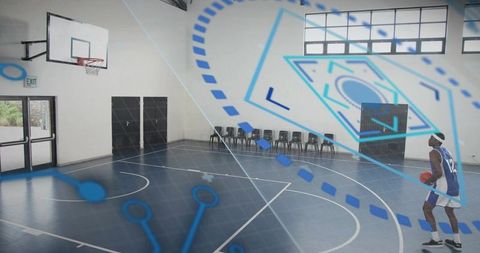 Dribbling basketball player wearing #12 jersey with augmented reality overlays in gym court