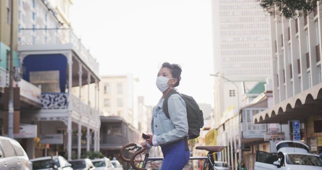 Woman Wearing Mask Holding Bicycle in City Street - Download Free Stock Images Pikwizard.com