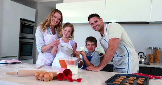 Smiling Family Baking Cookies Together in Modern Kitchen - Download Free Stock Images Pikwizard.com
