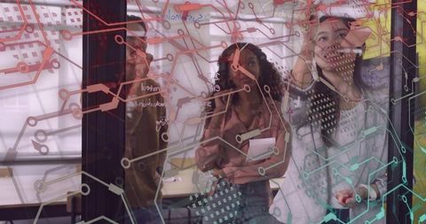 Team Collaborating on Futuristic Schematic in Modern Office