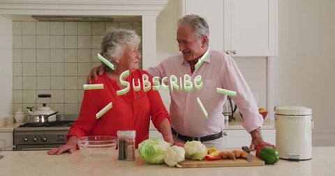 Smiling senior couple cooking together promoting healthy lifestyle