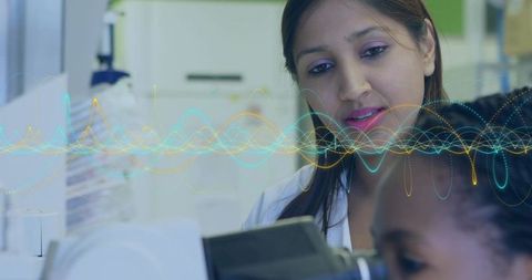 Innovative Scientist Analyzing Data with Waveform Overlay