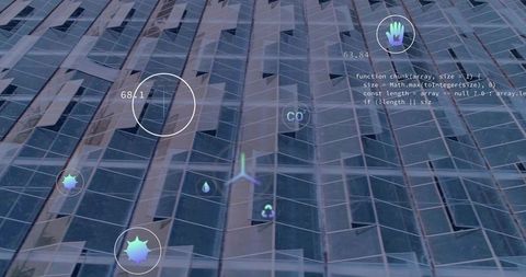 High-rise glass facade displaying augmented reality hud with data mesh and code readouts