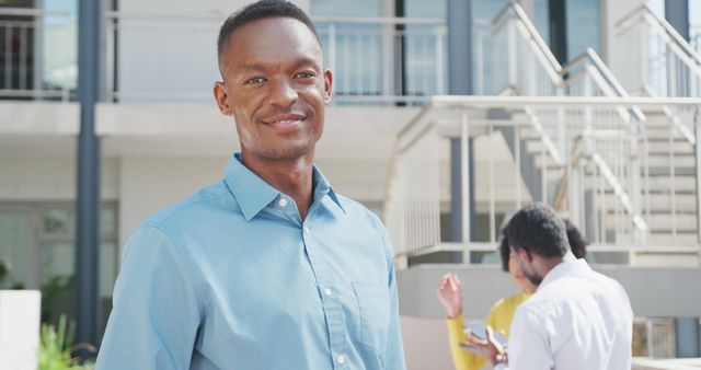 Confident Young Man Standing Outdoors in Business Environment - Download Free Stock Images Pikwizard.com