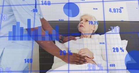 Clinician checking senior patient at bedside with blue data overlay visualizing clinical analytics