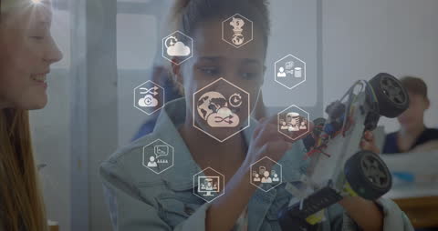 Diverse Girls Engaged in Technology and Robotics Project