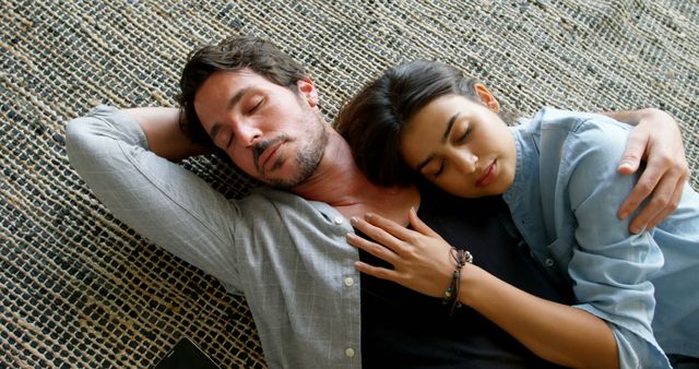 Couple relaxing together on floor at home 4k
