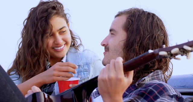 Young Couple Enjoying Music Outdoors - Download Free Stock Images Pikwizard.com