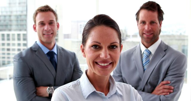 Confident Businesswoman with Two Male Colleagues in Modern Office - Download Free Stock Images Pikwizard.com