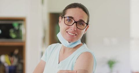 Woman Showing Vaccination Bandage During Covid-19 Recovery at Home