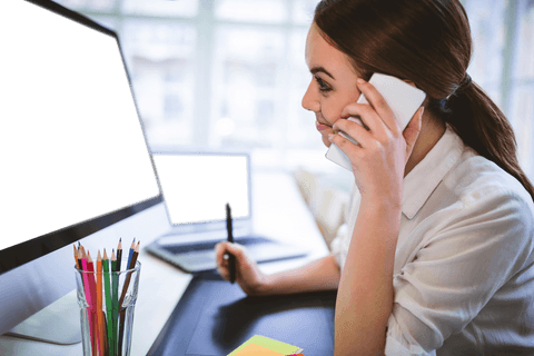 Businesswoman Using Phone and Laptop in Bright Office Transparent Background - Download Free Stock Videos Pikwizard.com