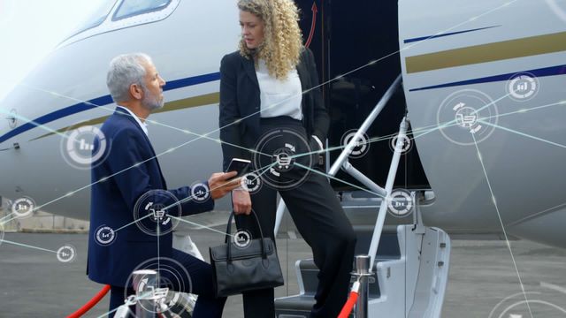 Business professionals engaged in conversation next to a private jet with digital interface elements overlaid. Ideal for illustrating modern business travel, technology in corporate environments, and professional communication. Suitable for ads related to luxury travel, corporate services, and technology-driven business solutions.