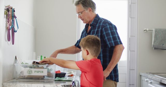 Grandfather and Grandson Sorting Recycling Together in Kitchen - Download Free Stock Images Pikwizard.com