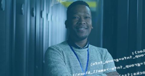 Engineer standing confidently in modern data center with code overlay