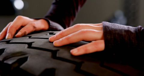 Woman engaging in tire training for fitness exercise