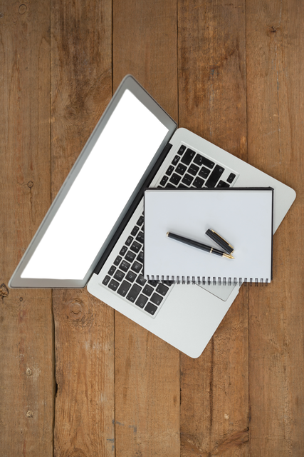 Transparent Laptop and Notebook on Wooden Office Table - Download Free Stock Videos Pikwizard.com