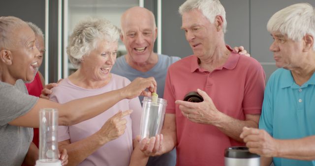 Seniors Enjoying Group Activity in Kitchen, Smiling and Collaborating - Download Free Stock Images Pikwizard.com