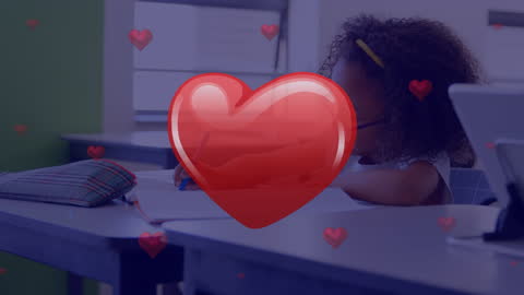 Heart Emojis Floating Over Student Studying in Classroom