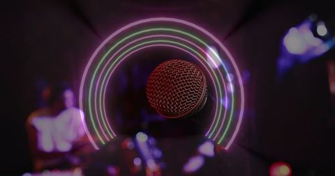 Glowing neon-ring microphone commanding club stage with bokeh lights and live vibe