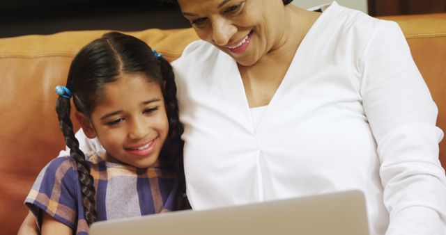 Smiling Grandmother Helping Granddaughter Online Learning at Home - Download Free Stock Images Pikwizard.com