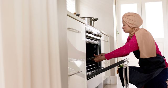 Woman Wearing Hijab Baking in Modern Home Kitchen - Download Free Stock Images Pikwizard.com