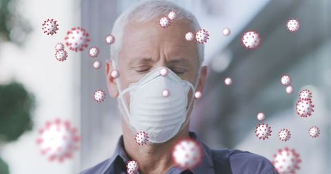 Senior wearing mask amid covid-19 virus particles in air