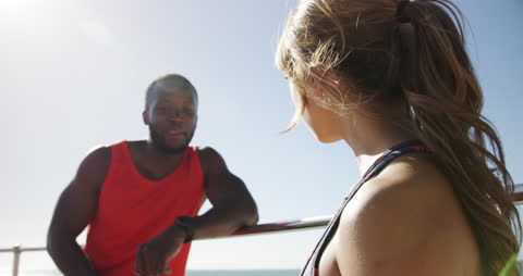 Couple Enjoying Beach Promenade on Sunny Day