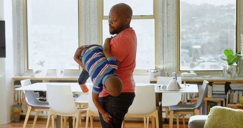 Father and Son Playing Joyfully at Home - Download Free Stock Images Pikwizard.com