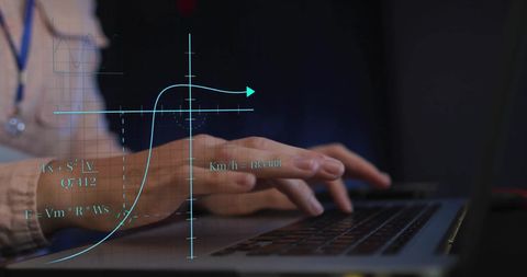 Female it technician analyzing scientific data on laptop