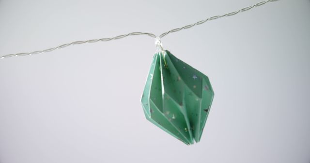 Green Origami Decoration Hanging on Twisted Wire - Download Free Stock Images Pikwizard.com